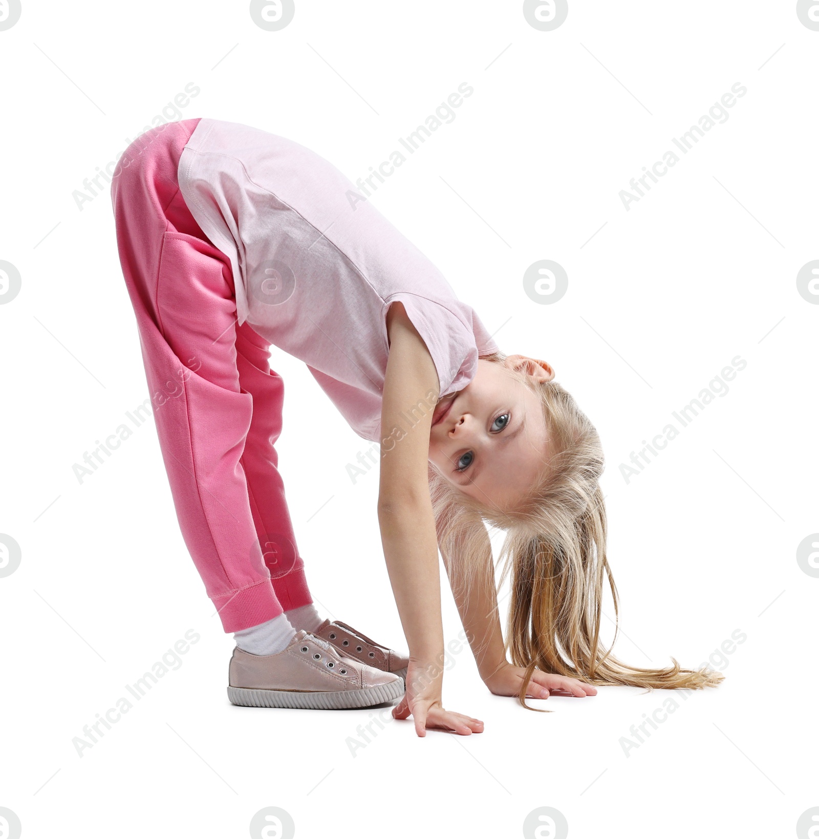 Photo of Little girl exercising on white background. Sport activity