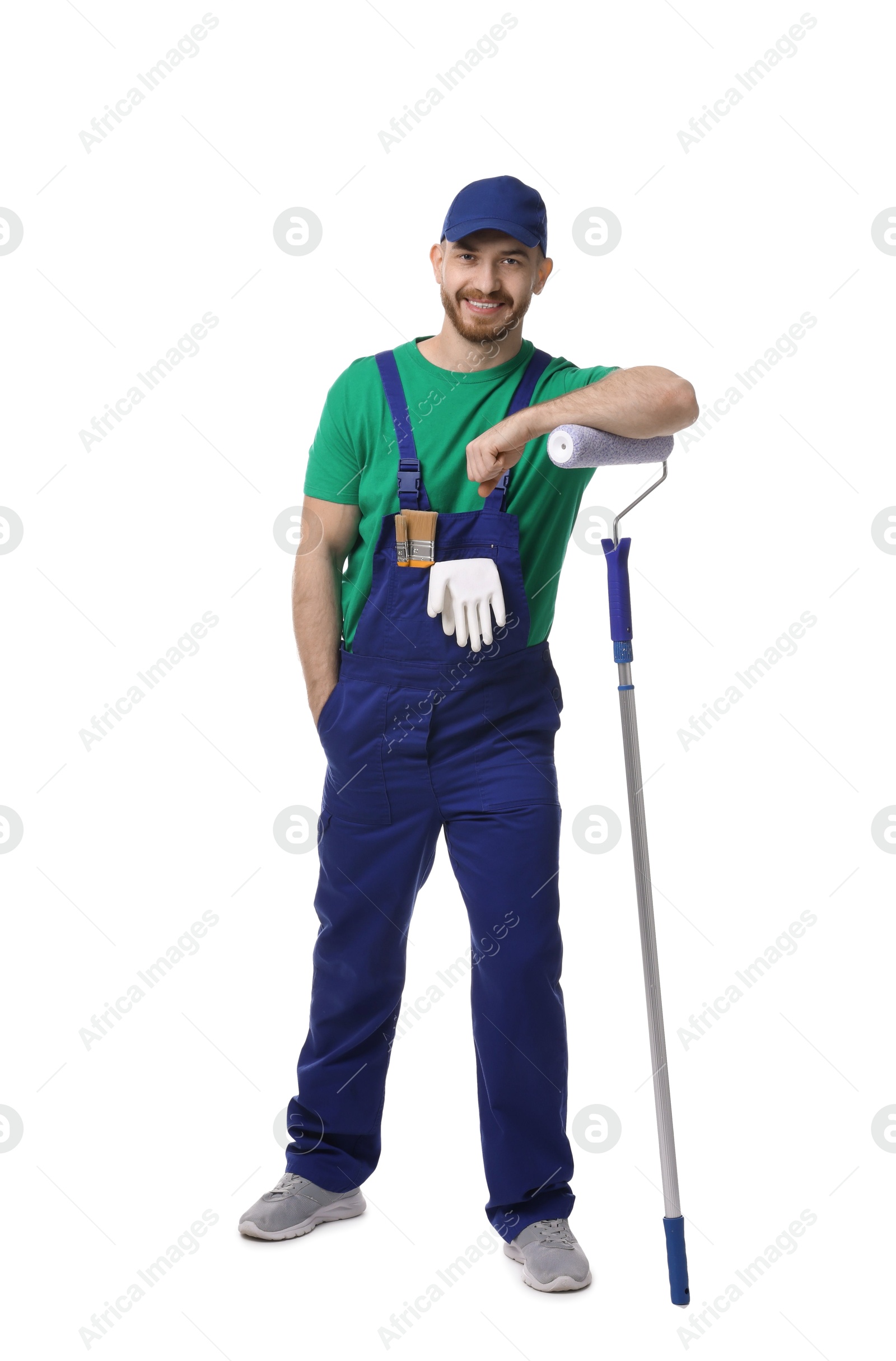 Photo of Professional painter with roller on white background