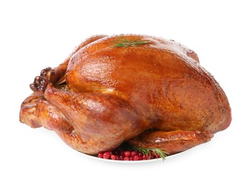 Photo of Whole baked turkey with cranberries and rosemary isolated on white