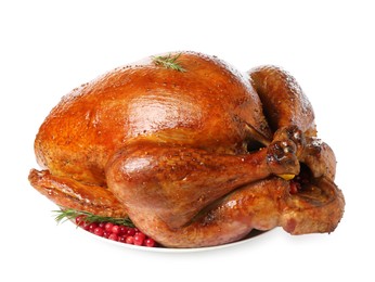 Photo of Whole baked turkey with cranberries and rosemary isolated on white