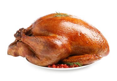 Photo of Whole baked turkey with cranberries and rosemary isolated on white