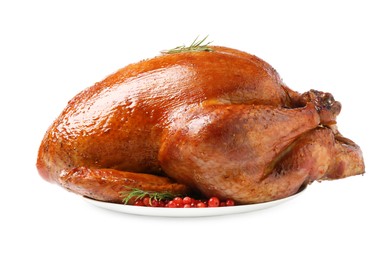 Photo of Whole baked turkey with cranberries and rosemary isolated on white