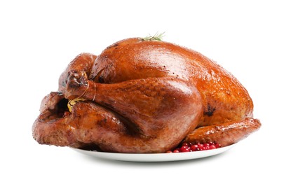 Photo of Whole baked turkey with cranberries and rosemary isolated on white