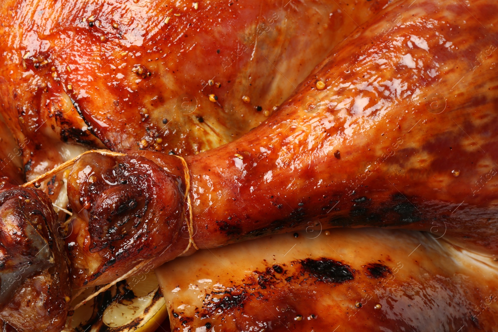 Photo of Delicious freshly baked turkey as background, closeup