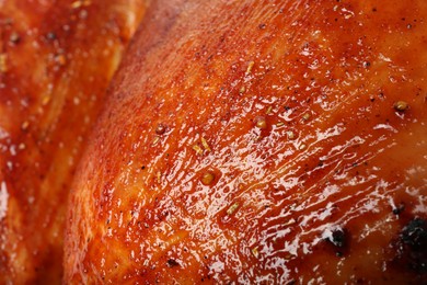 Photo of Delicious freshly baked turkey as background, closeup