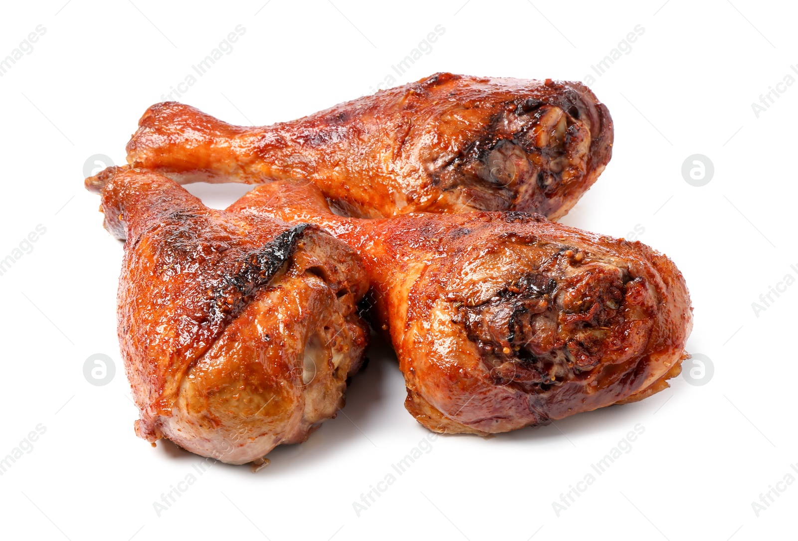 Photo of Delicious baked turkey drumsticks isolated on white