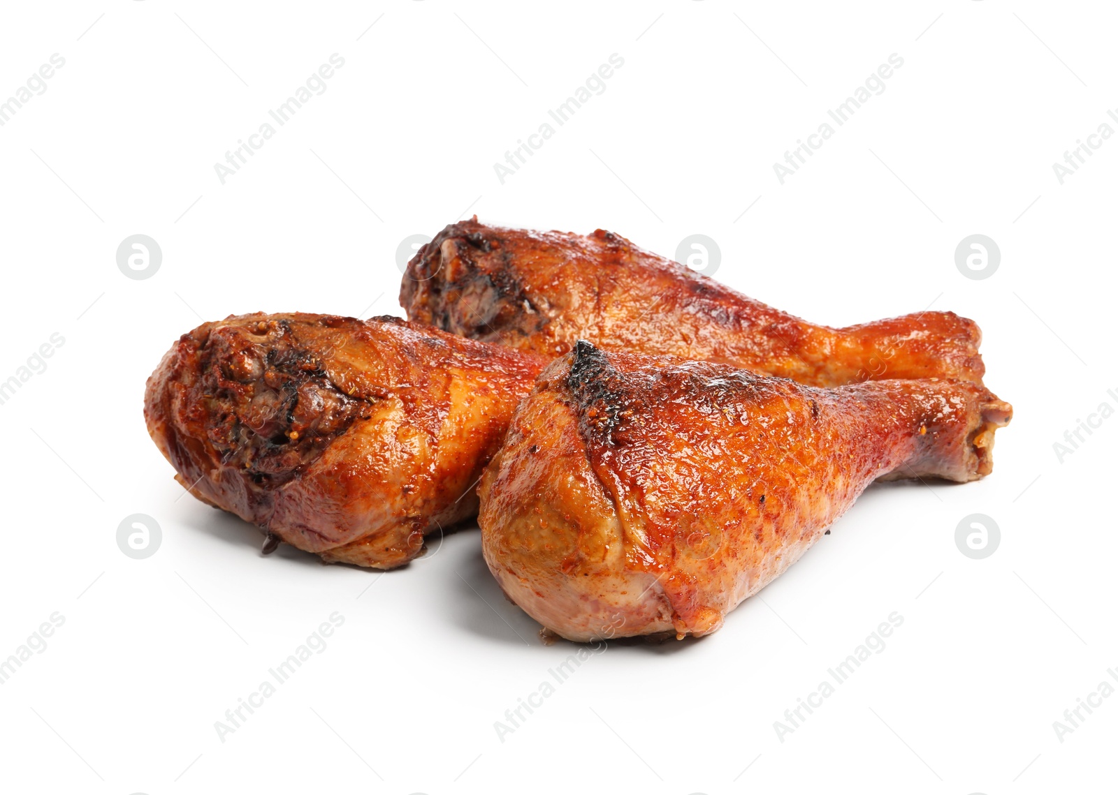 Photo of Delicious baked turkey drumsticks isolated on white