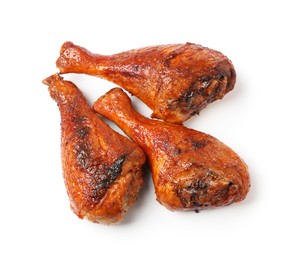 Photo of Delicious baked turkey drumsticks isolated on white, top view