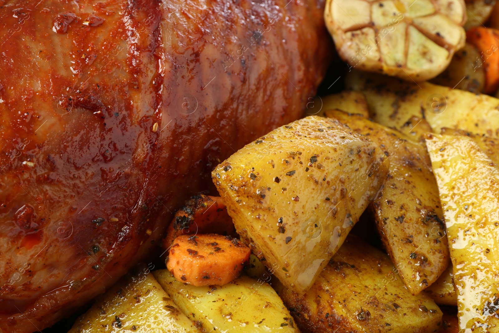 Photo of Baked turkey drumstick and vegetables as background, closeup