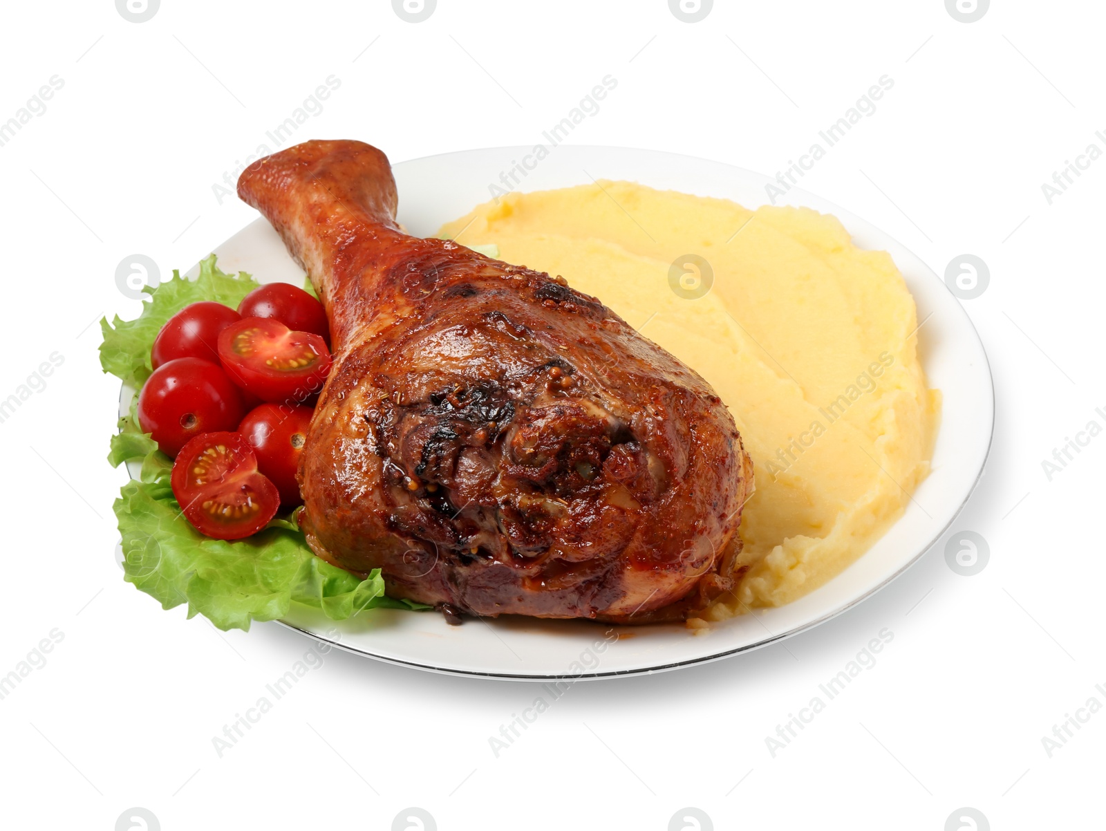 Photo of Baked turkey drumstick with mashed potato and tomatoes isolated on white