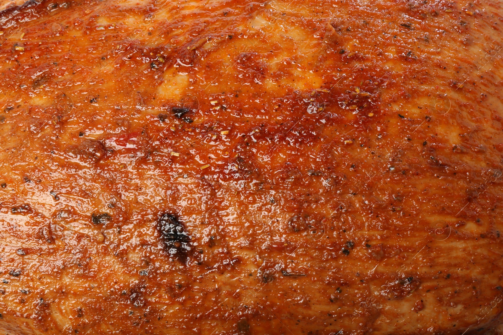 Photo of Piece of delicious baked turkey as background, closeup