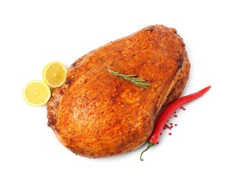 Photo of Piece of delicious baked turkey with lemon slices and spices isolated on white, top view