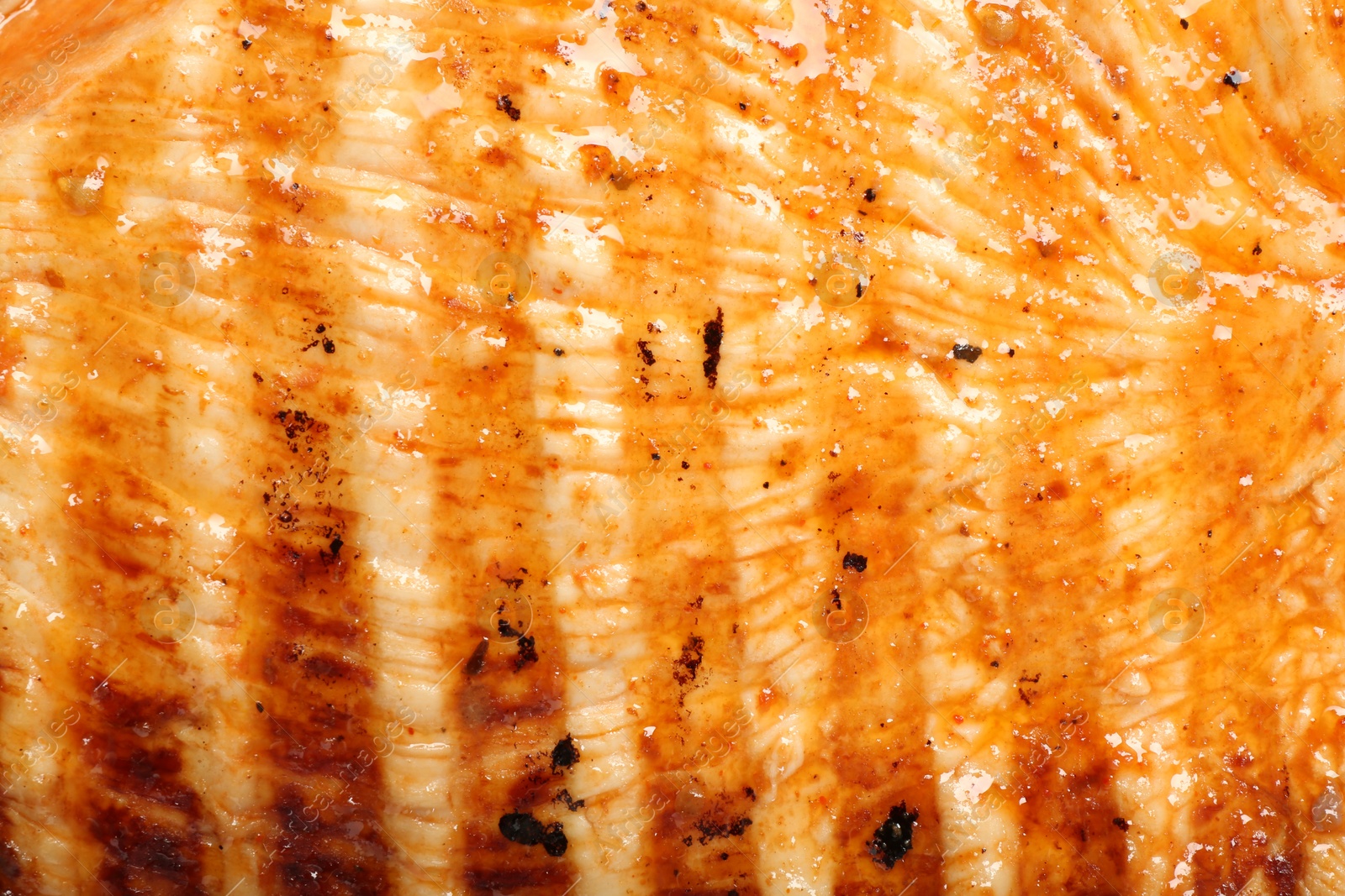 Photo of Delicious grilled turkey breast as background, closeup