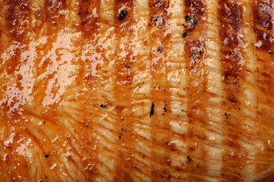 Photo of Delicious grilled turkey breast as background, closeup