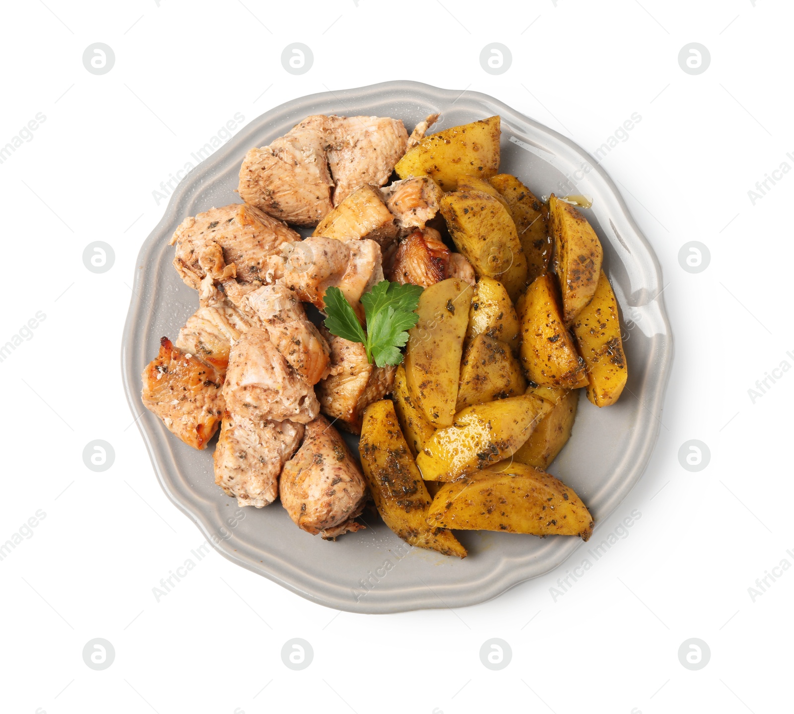 Photo of Pieces of delicious baked turkey and potatoes isolated on white, top view