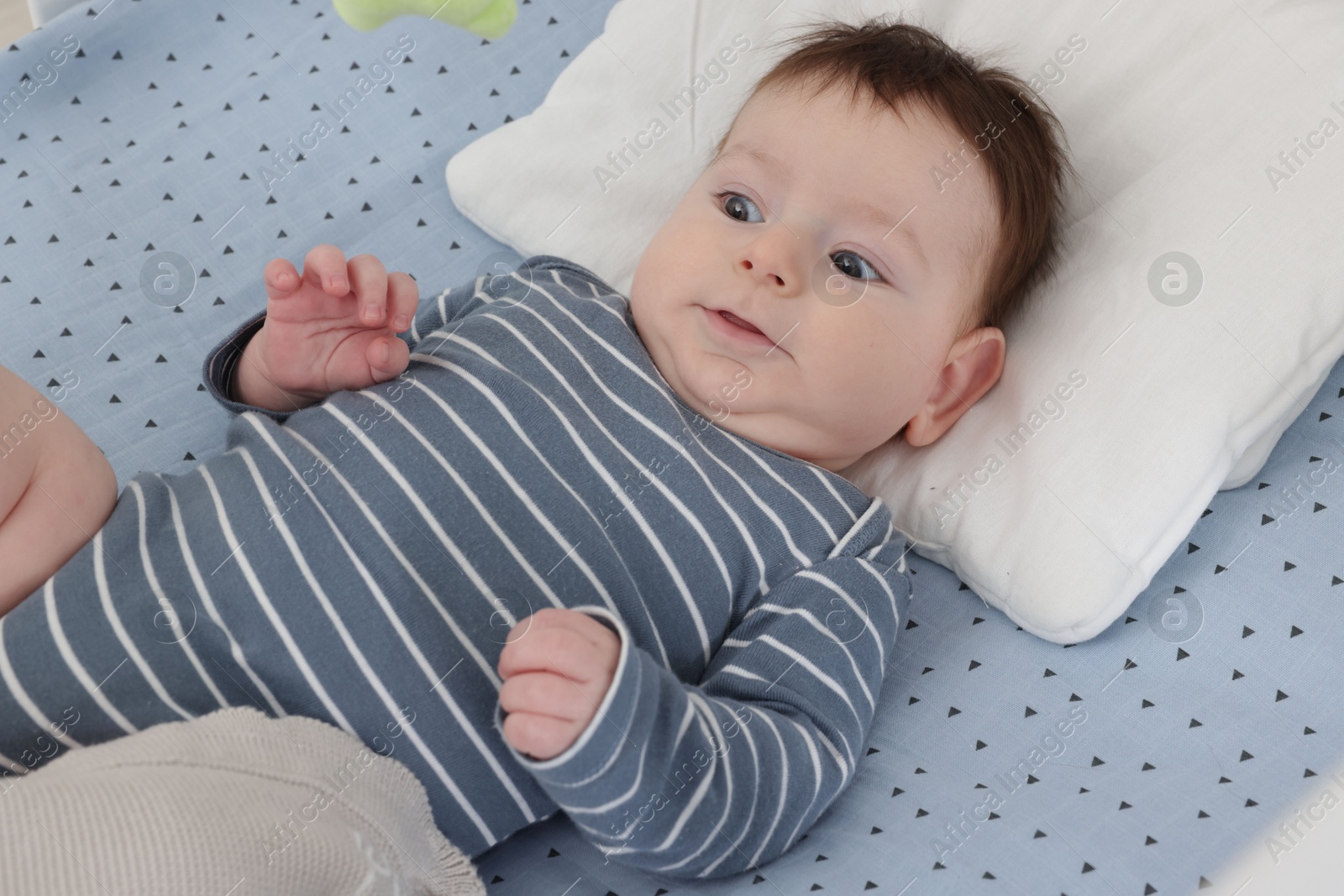 Photo of Cute little baby in crib at home