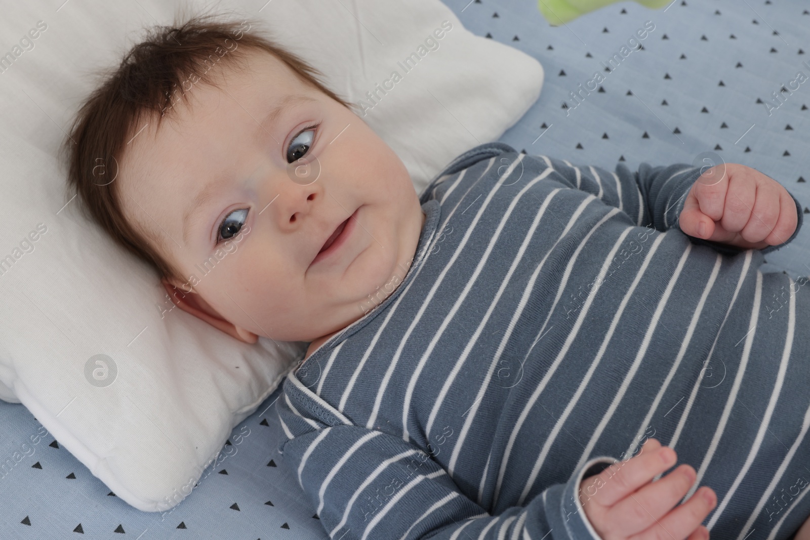 Photo of Cute little baby in crib at home