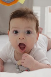 Photo of Cute little baby in crib at home