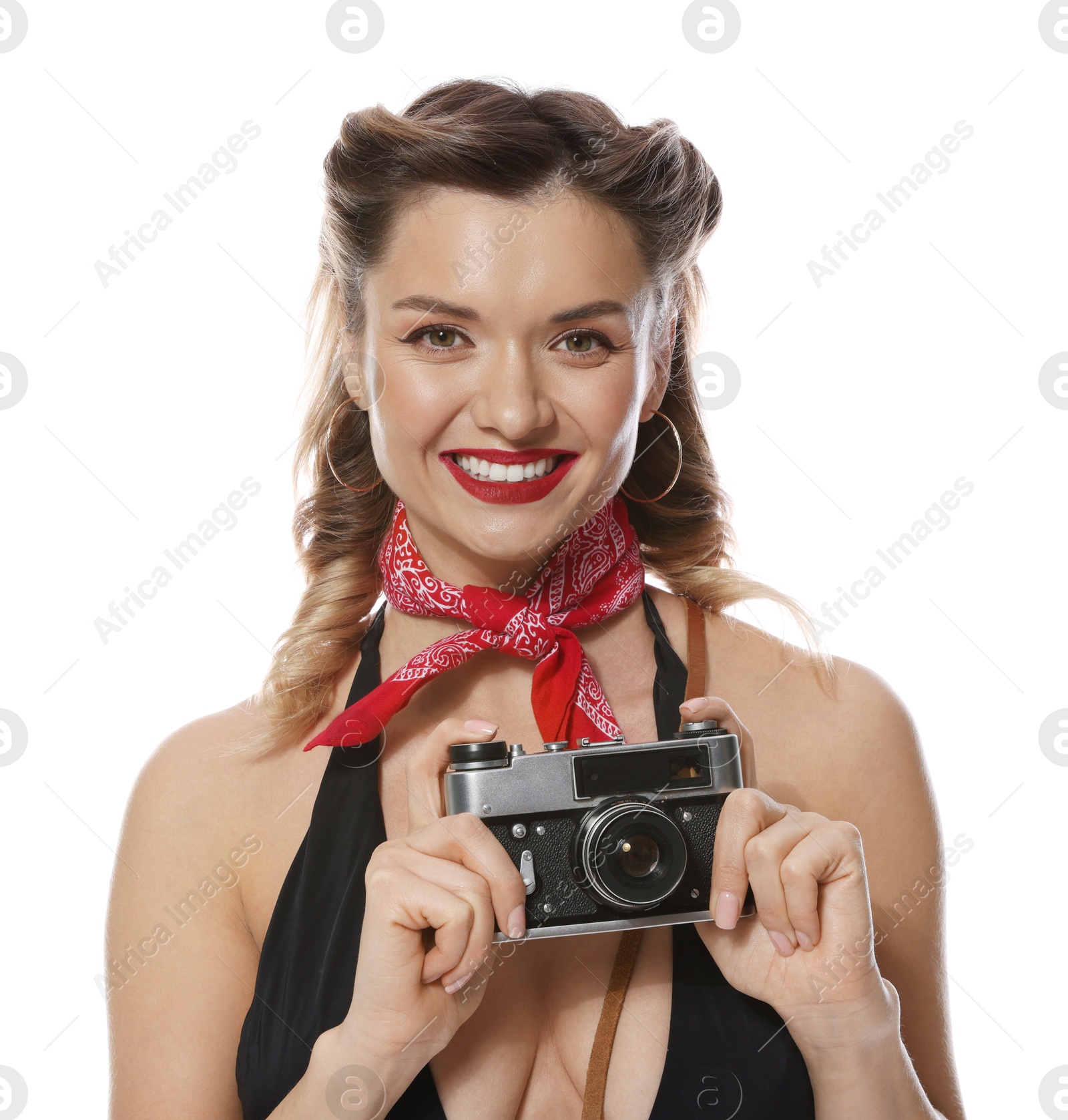 Photo of Happy pin-up woman with vintage camera on white background