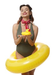 Photo of Happy pin-up woman in swimsuit with rubber duck and inflatable ring on white background