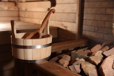 Photo of Bucket, ladle and hot rocks in sauna