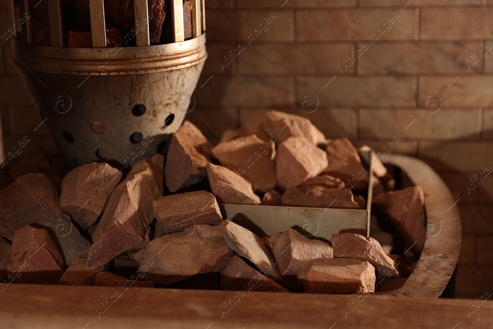 Photo of Stove with many hot rocks in sauna