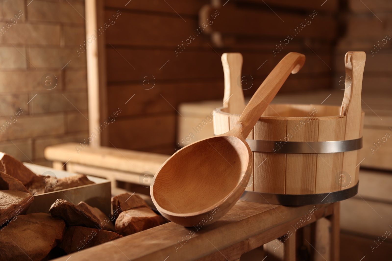 Photo of Bucket, ladle and hot rocks in sauna