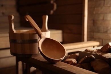 Photo of Bucket, ladle and hot rocks in sauna