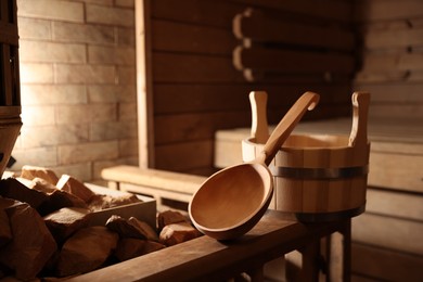 Bucket, ladle and hot rocks in sauna