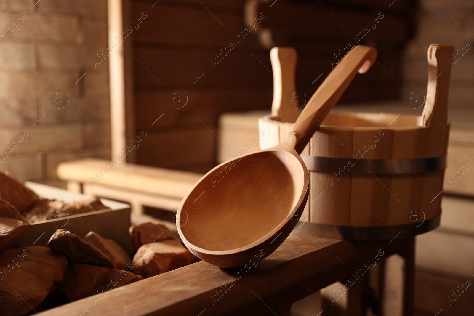 Photo of Bucket, ladle and hot rocks in sauna