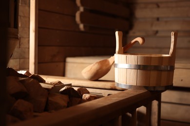 Photo of Bucket, ladle and hot rocks in sauna