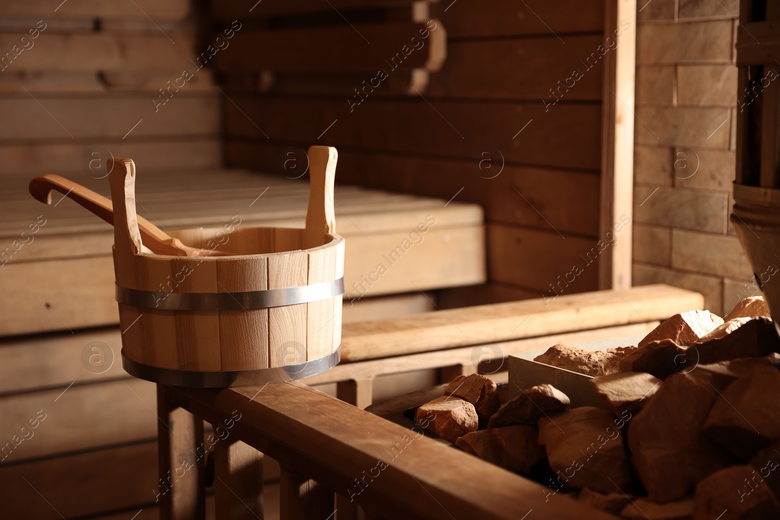 Photo of Bucket, ladle and hot rocks in sauna