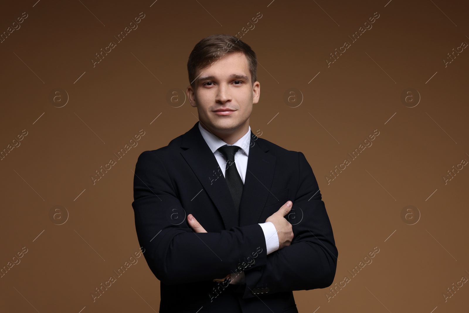 Photo of Man in classic suit on brown background