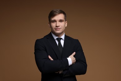 Photo of Man in classic suit on brown background