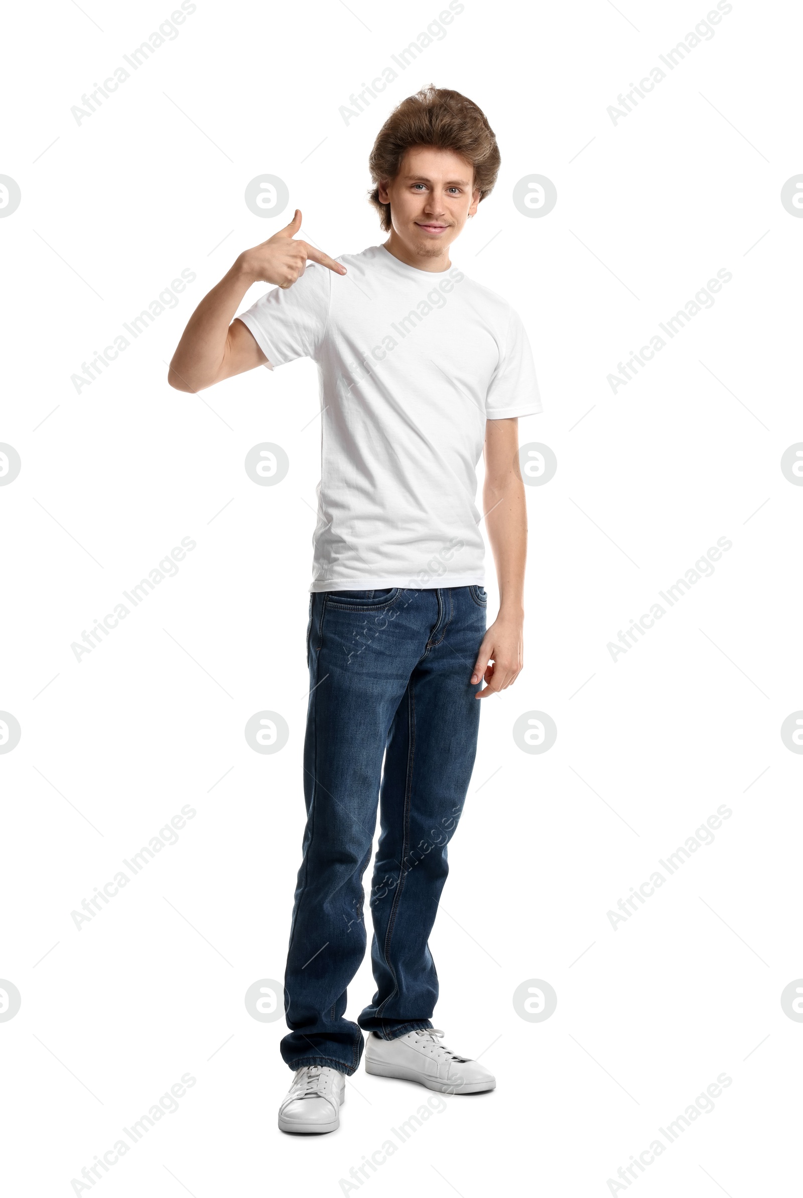 Photo of Young man wearing blank t-shirt on white background. Mockup for design