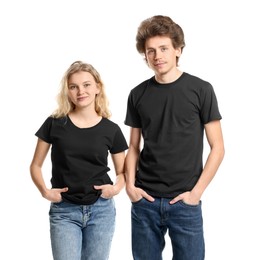 Photo of Young woman and man wearing blank black t-shirts on white background. Mockup for design