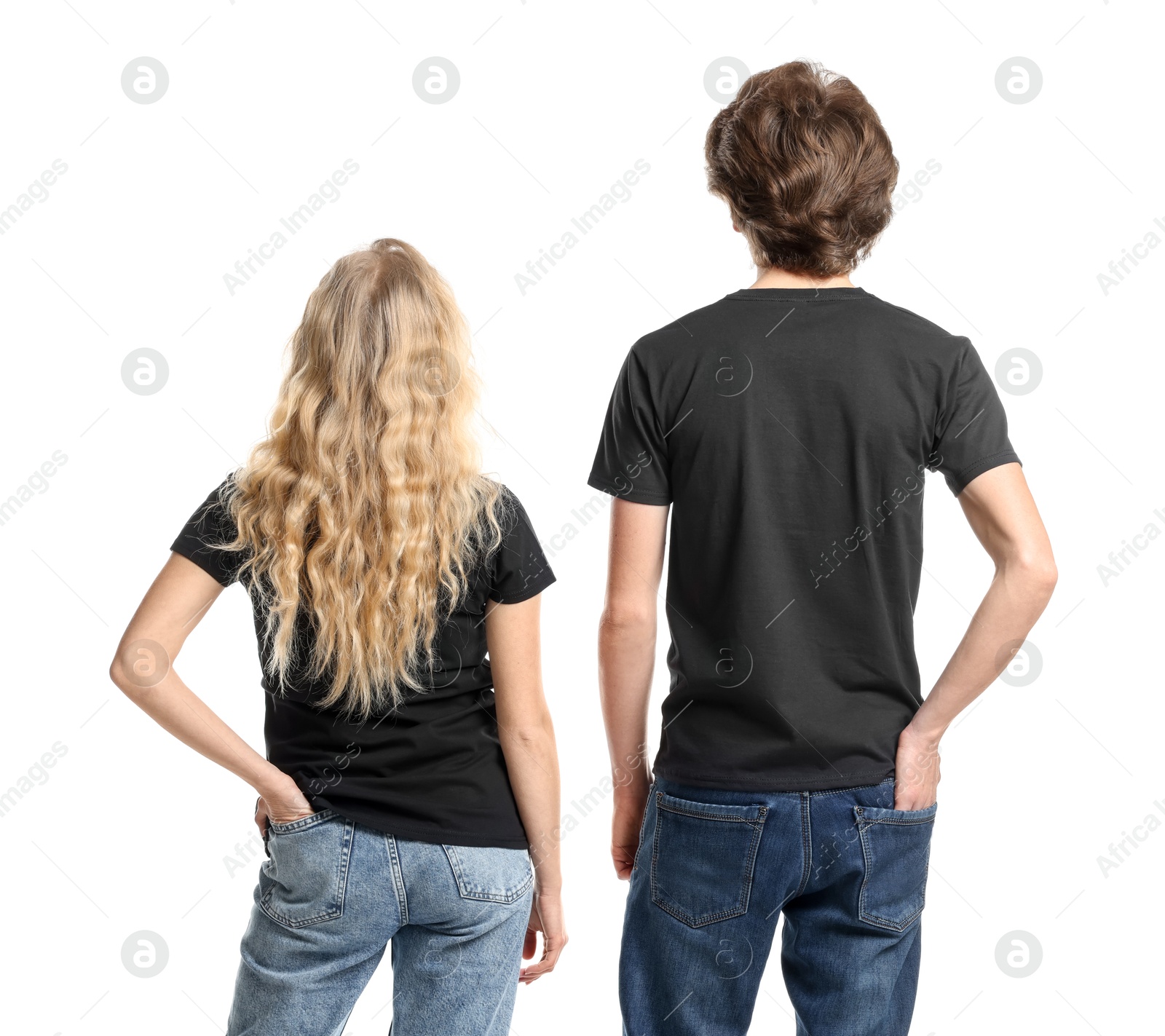 Photo of Young woman and man wearing blank black t-shirts on white background, back view. Mockup for design