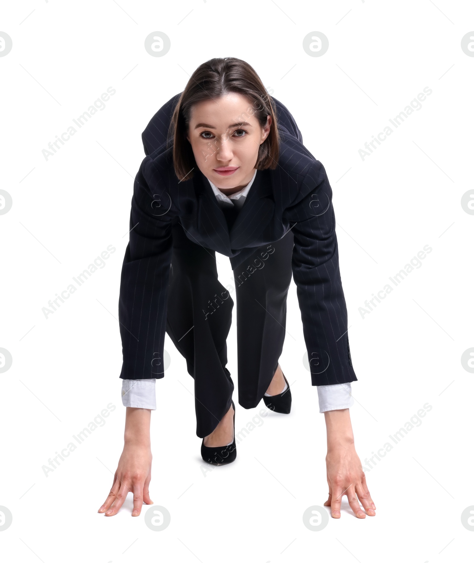 Photo of Businesswoman in starting position for run ready for competition on white background