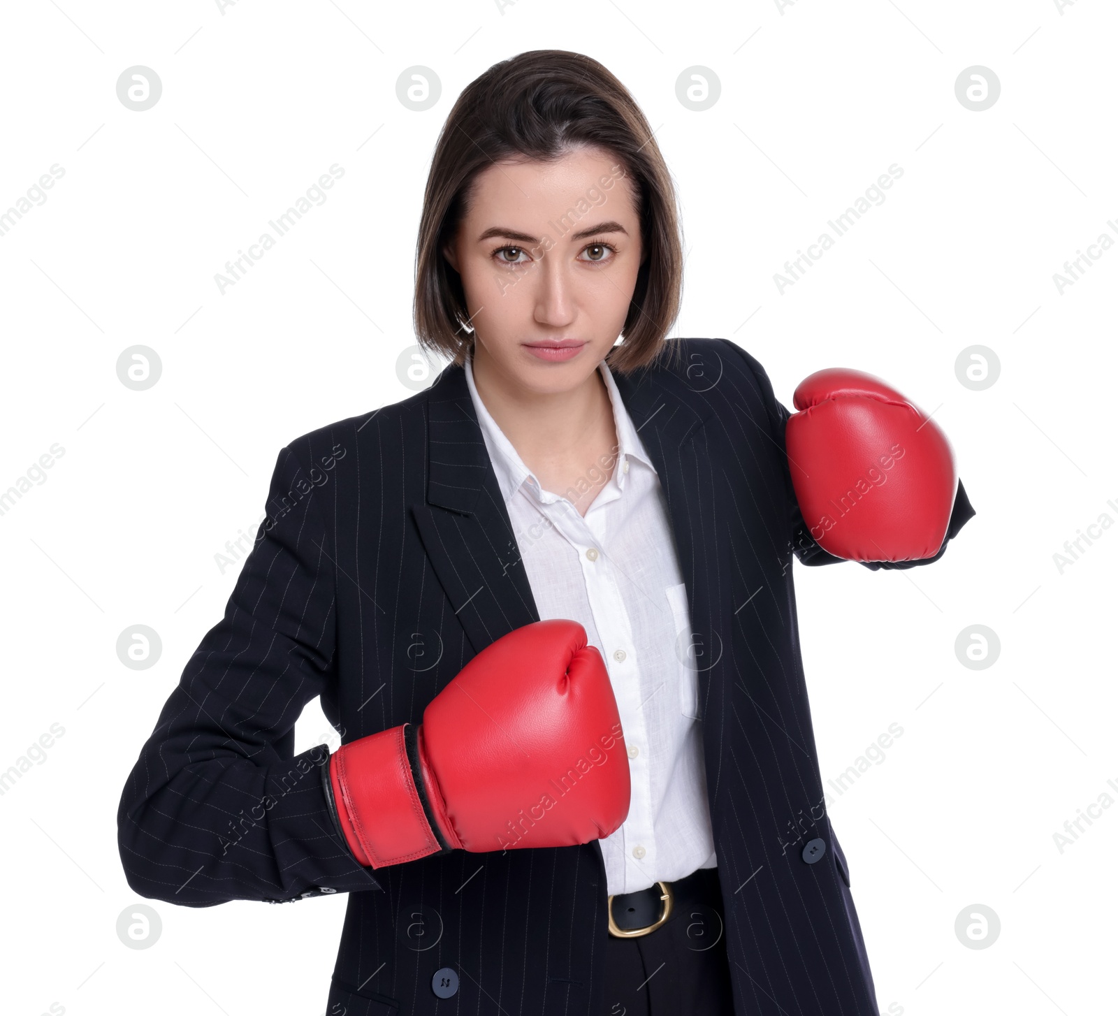 Photo of Competition. Businesswoman in suit wearing boxing gloves on white background