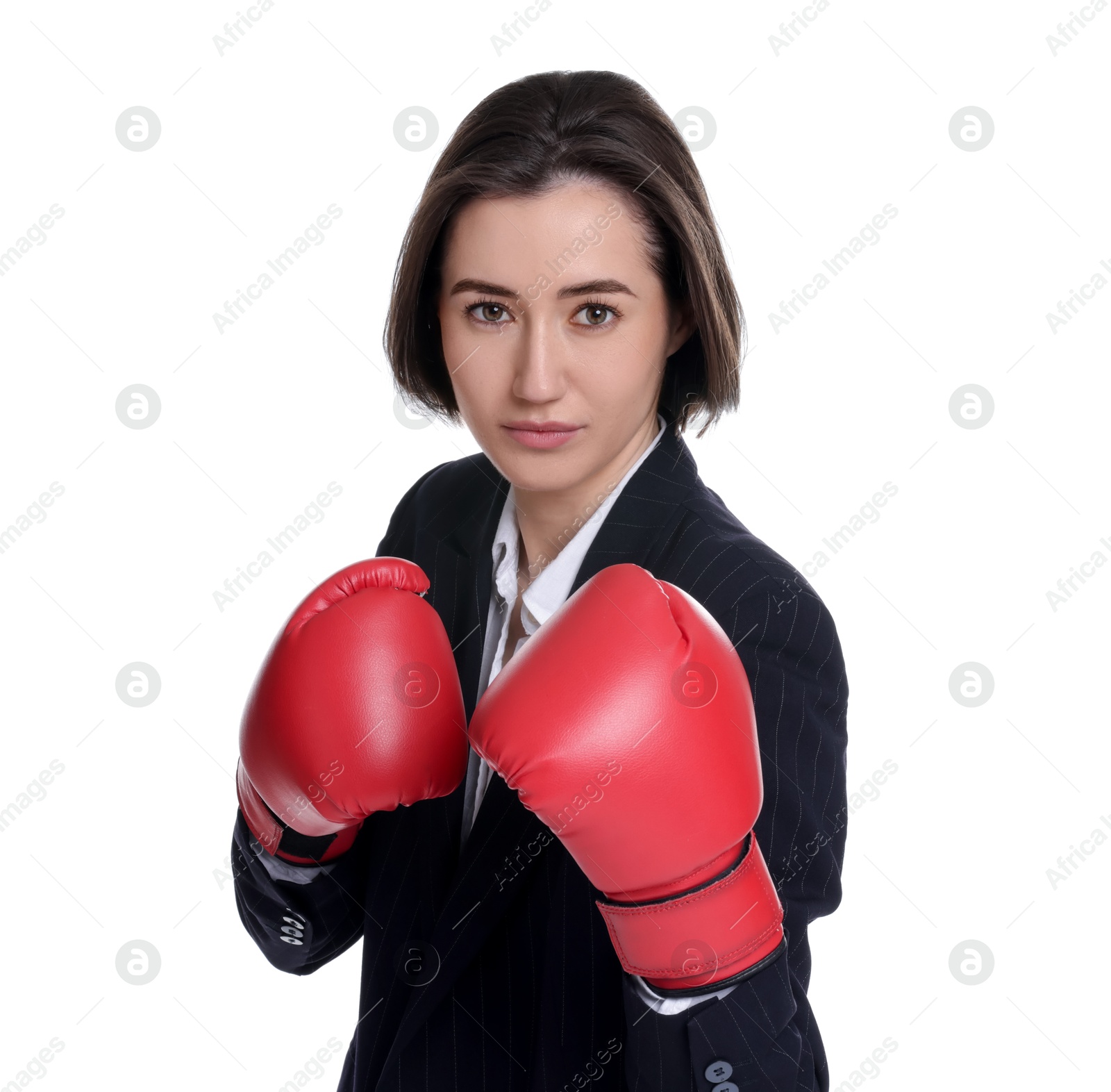 Photo of Competition. Businesswoman in suit wearing boxing gloves on white background