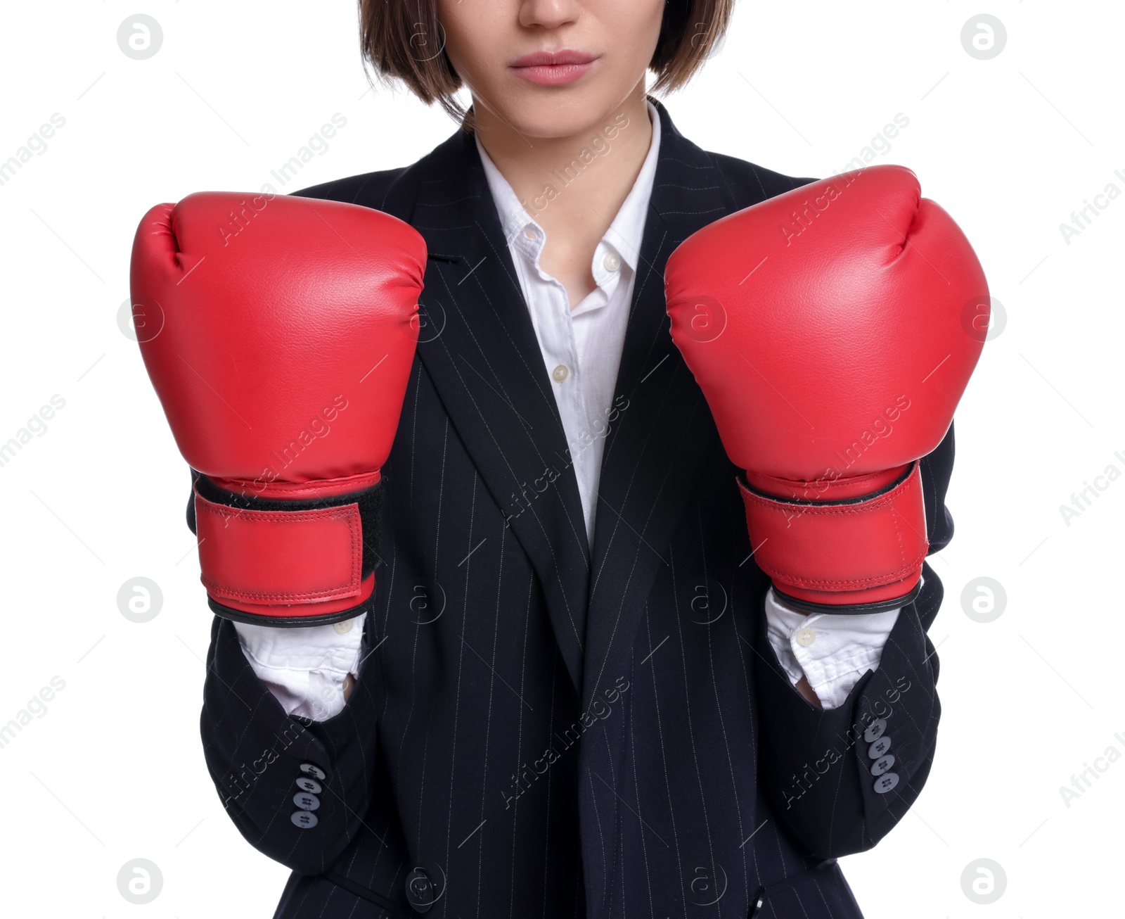 Photo of Competition. Businesswoman in suit wearing boxing gloves on white background, closeup