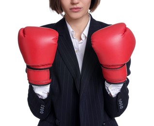 Photo of Competition. Businesswoman in suit wearing boxing gloves on white background, closeup