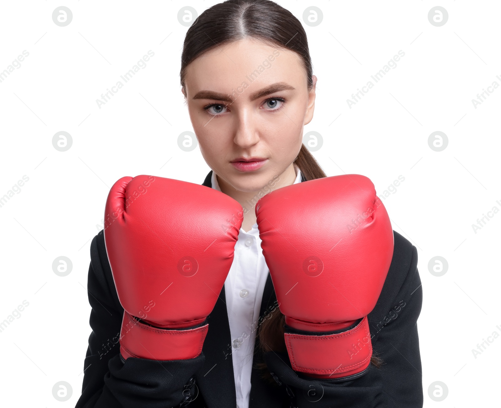 Photo of Competition. Businesswoman in suit wearing boxing gloves on white background