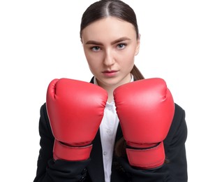 Photo of Competition. Businesswoman in suit wearing boxing gloves on white background