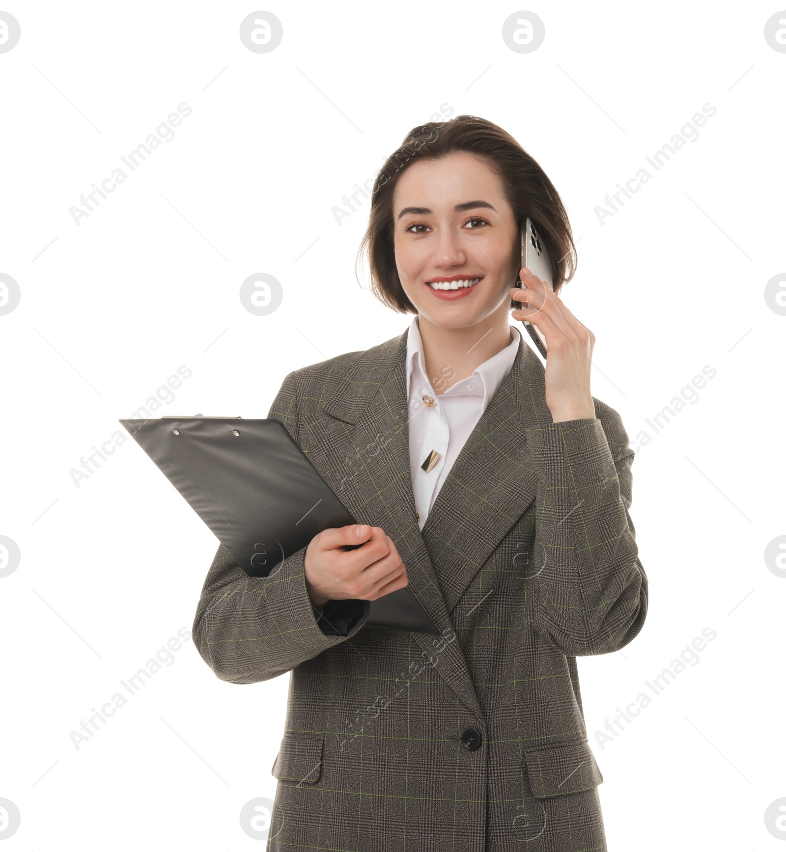 Photo of Smiling secretary with clipboard talking on smartphone against white background