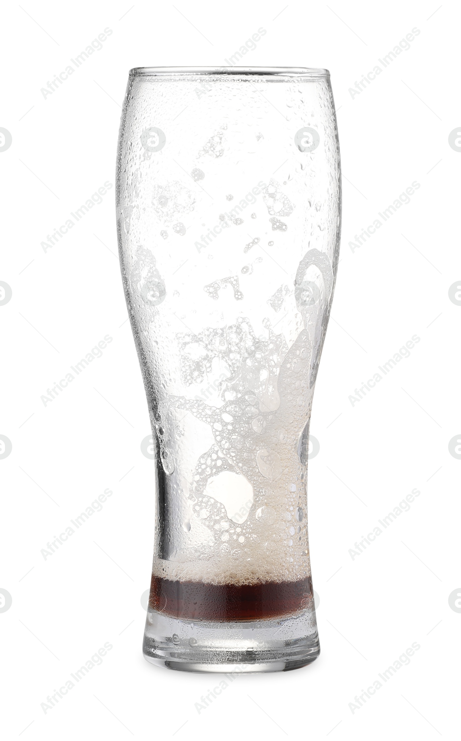 Photo of Almost empty glass of beer isolated on white