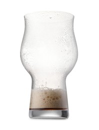 Almost empty glass of beer isolated on white