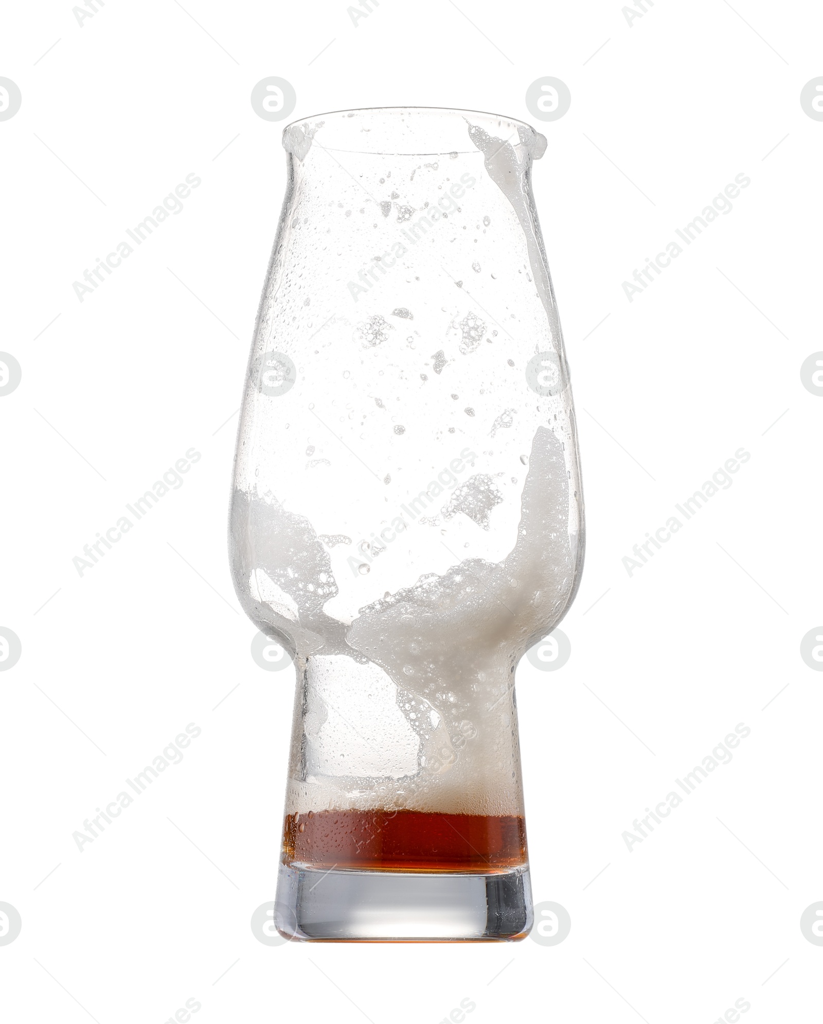 Photo of Almost empty glass of beer isolated on white