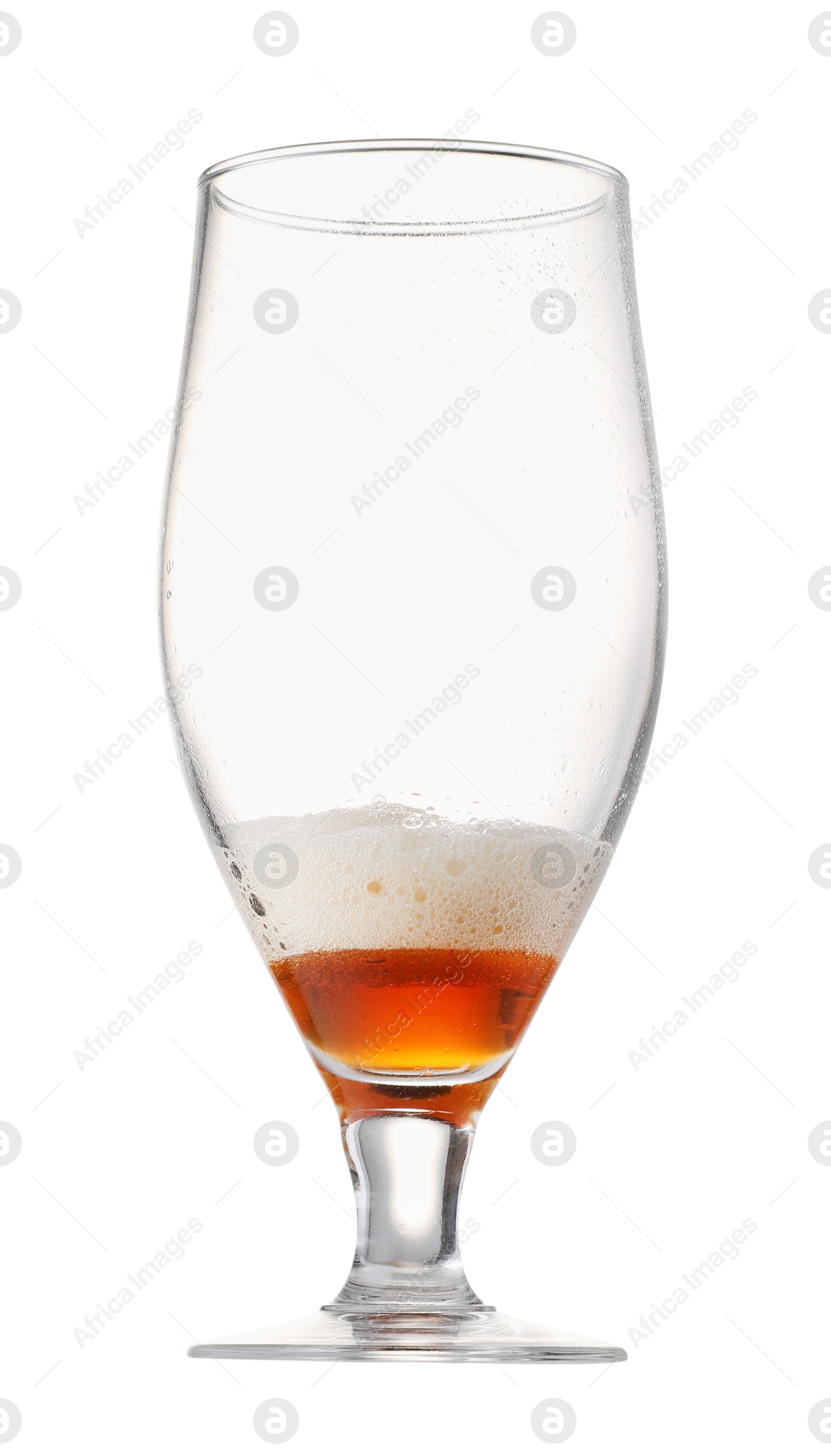 Photo of Almost empty glass of beer isolated on white