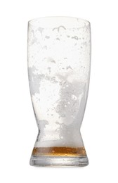 Photo of Almost empty glass of beer isolated on white